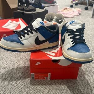 Nike low Dunks. Men's size 12 Black, Blue, and White color way